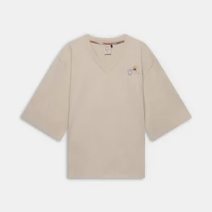 Camiseta oversize beige con cuello de pico