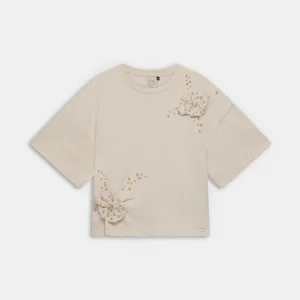 Camiseta beige con aplicación floral